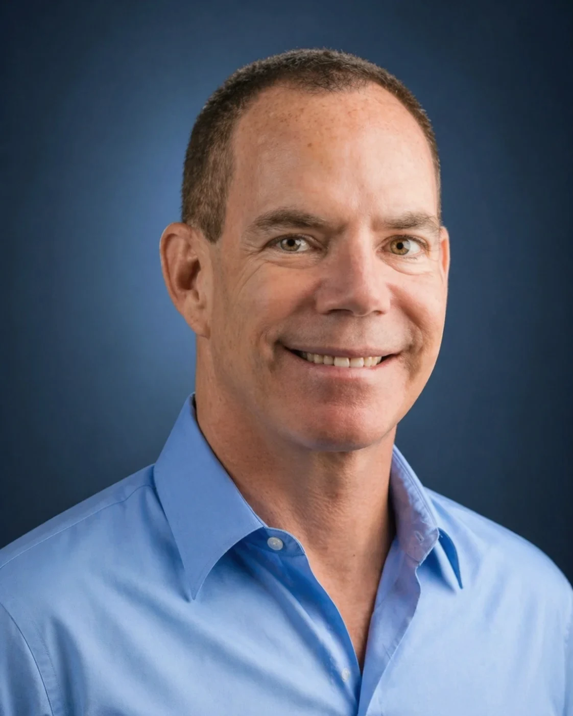 Rob Sarison smiling in a blue shirt