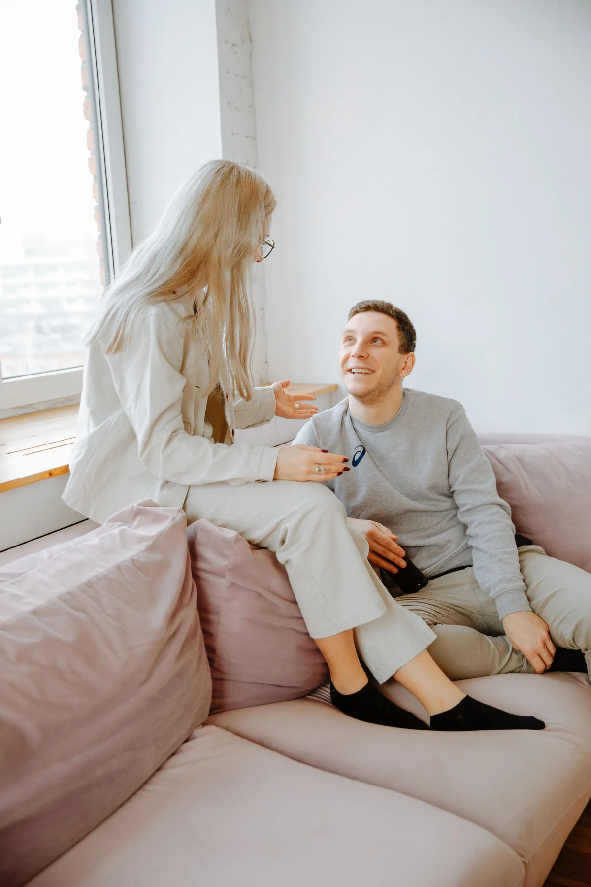 Two people enjoying a conversation together on a sofa