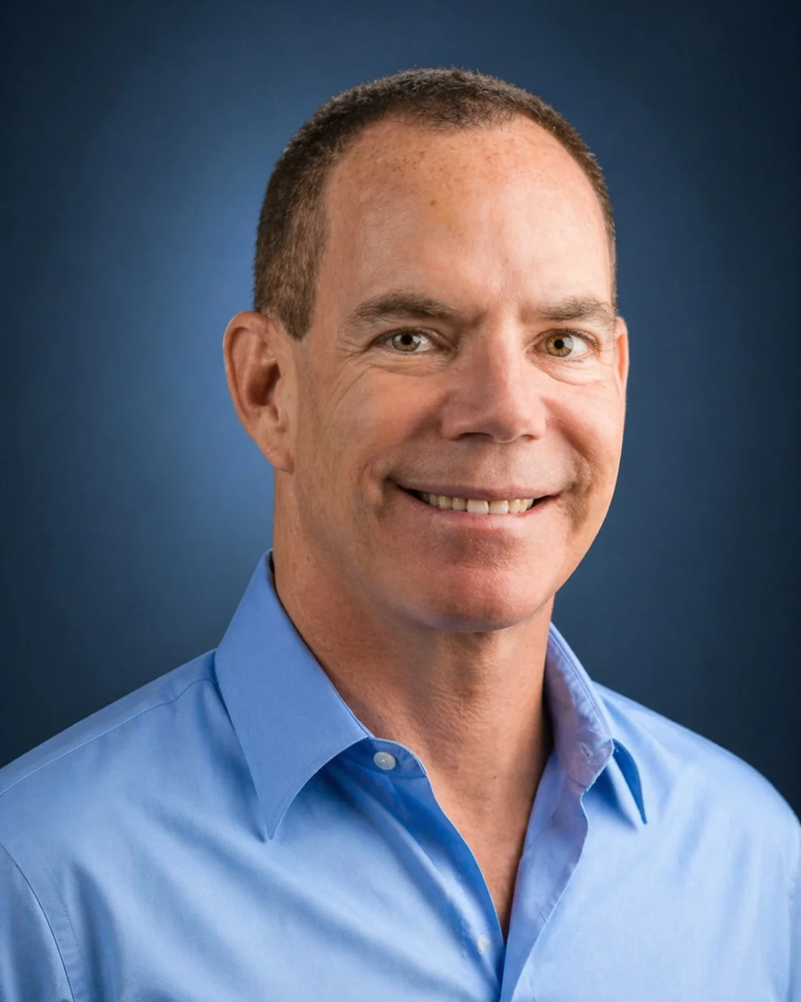 Rob Sarison smiling in a blue shirt